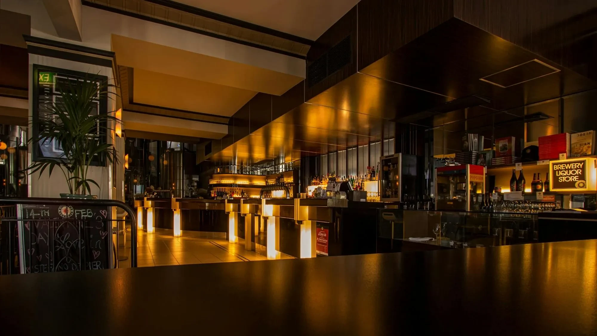 A restaurant with a finely painted bar and smooth finish