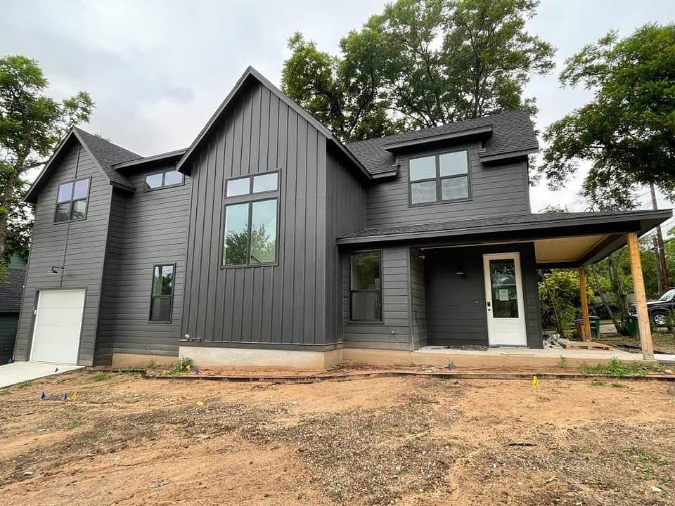 Painted clapboard siding and trim on a Texas home